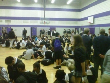 Students gather in the gym of one of two Ajax high schools that were under lockdown on Monday, Oct. 18, 2010.