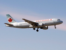 An Air Canada plane lands at Pearson Airport in Toronto on Friday February 13, 2009. (THE CANADIAN PRESS/Frank Gunn)