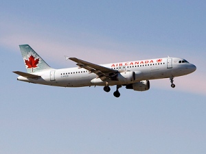 An Air Canada plane lands at Pearson Airport in Toronto on Friday February 13, 2009. (THE CANADIAN PRESS/Frank Gunn)