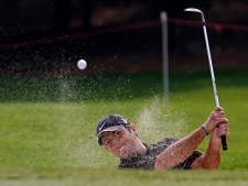 Francesco Molinari of Italy hits the ball from the bunker at the 12th hole during the second round of the HSBC Champions golf tournament at the Shanghai Sheshan International Golf Club Friday, Nov. 5, 2010 in Shanghai, China. Molinari finished the second day as the leader with the score of 9 under. (AP Photo)