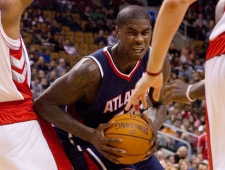 Atlanta Hawks Marvin Williams drives at the Toronto Raptors' defence during first half NBA basketball action in Toronto Sunday, November 28, 2010. THE CANADIAN PRESS/Chris Young