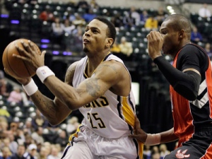 Indiana Pacers guard Brandon Rush (25) goes to the basket against Toronto Raptors guard Leandro Barbosa of Brazil during the fourth quarter of an NBA basketball game in Indianapolis, Monday, Dec. 6, 2010. 