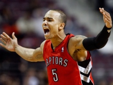 Toronto Raptors' Jerryd Bayless reacts after sinking a three-point basket to give the Raptors a 113-110 lead over the Detroit Pistons in the fourth quarter of an NBA basketball game Saturday, Dec. 11, 2010, in Auburn Hills, Mich.