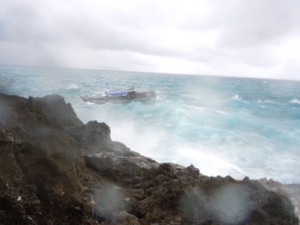 An asylum seeker boat approaches the rocky shore on Christmas Island just before it breaks up on the rocks Wednesday, Dec. 15, 2010. (AP Photo/ABC)