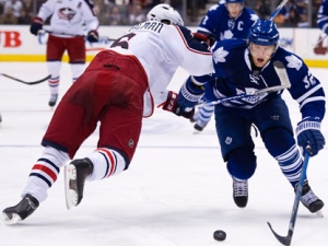 Toronto Maple Leafs forward Kris Versteeg, right, skates past Columbus Blue Jackets defenceman Anton Stralman, left, during second period NHL hockey action in Toronto on Thursday, December 30, 2010. (THE CANADIAN PRESS/Nathan Denette)