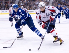 Washington Capitals' Alex Ovechkin, right, skates past Toronto Maple Leafs' Luke Schenn during third period NHL hockey action in Toronto Saturday, January 22, 2011. Ovechkin scored a hat trick in the Capitals' 4-1 victory over the Maple Leafs. THE CANADIAN PRESS/Darren Calabrese