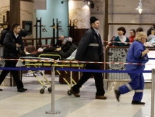 A wounded blast victim is moved on a stretcher at Domodedovo airport in Moscow, Monday, Jan. 24, 2011. (AP Photo/Ivan Sekretarev)