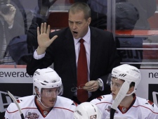 Carolina Hurricanes head coach Paul Maurice talks to his team during an NHL game against the Washington Capitals on Sunday, Nov. 28, 2010, in Washington. It was Maurice's 1000th NHL game coached. (AP/Luis M. Alvarez)