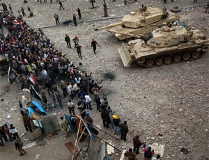 Egyptian army soldiers take up positions in front of anti-government protesters next to Tahrir square in Cairo, Egypt, Saturday, Feb. 5, 2011. (AP / Emilio Morenatti)