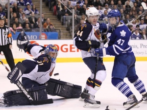 Atlanta Thrashers defenceman Arturs Kulda tries to hold off Toronto Maple Leafs forward Darryl Boyce as the puck beats goaltender Ondrej Pavelec on Monday, Feb. 7, 2011. (THE CANADIAN PRESS/Frank Gunn)