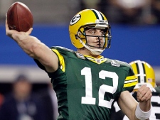 Green Bay Packers' Aaron Rodgers throws a touchdown pass during the second half of the NFL football Super Bowl XLV game against the Pittsburgh Steelers Sunday, Feb. 6, 2011, in Arlington, Texas. (AP Photo/Chris O'Meara)