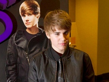 Justin Bieber poses prior to the screening of his new film "Justin Bieber: Never Say Never" in Toronto Tuesday, February 1, 2011. (THE CANADIAN PRESS/Darren Calabrese)