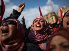 Egyptian anti-Mubarak protesters shout slogans during a demonstration at Tahrir square in Cairo, Egypt, Tuesday, Feb. 8, 2011. (AP Photo/Emilio Morenatti)