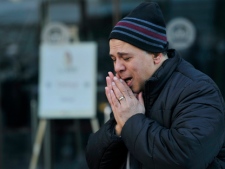 A man becomes emotional outside the Egyptian consulate in Montreal on Friday, Feb. 11, 2011, after learning Egytian president Hosni Moubarak has stepped down from power. (THE CANADIAN PRESS/Graham Hughes)