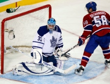 Montreal Canadiens center David Desharnais (58) scores the third goal on Toronto Maple Leafs goalie Jean-Sebastien Giguere (35) during third  period NHL hockey action Saturday, February 12, 2011  in Montreal. Montreal won the game 3-0.THE CANADIAN PRESS/Ryan Remiorz