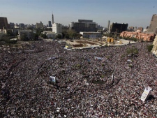 Thousands gather in Tahrir square for Friday prayers and a demonstration in Cairo, Egypt, Friday Feb. 18, 2011. (AP Photo/Enric Marti)