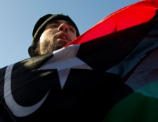 A protester takes part in a rally against the violence in Libya on Parliament Hill in Ottawa on Monday, Feb. 21, 2011. THE CANADIAN PRESS/Sean Kilpatrick