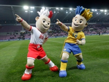 The two mascots of the EURO 2012 European Soccer Championships in Poland and Ukraine pose prior an international friendly soccer match between Switzerland and Ukraine at the Stade de Geneve stadium in Geneva on Wednesday, Nov. 17, 2010. (AP Photo/Keystone/Salvatore Di Nolfi)