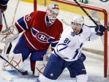 Toronto Maple Leafs' Phil Kessel celebrates his goal past Montreal Canadiens goalie Alex Auld during first period NHL hockey action Thursday, February 24, 2011 in Montreal. (THE CANADIAN PRESS/Paul Chiasson)