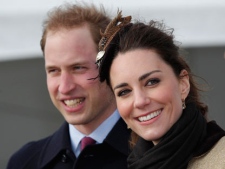 Britain's Prince William and his fiance Kate Middleton react following a naming ceremony and Service dedication for the Royal National Lifeboat Institution's new Atlantic 85 Lifeboat, at Trearddur Bay Lifeboat Station in Anglesey, Wales, Thursday Feb. 24, 2011. (AP Photo/Phil Noble, Pool)