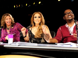 In this undated publicity image released by Fox, "American Idol" judges, from left, Steven Tyler, Jennifer Lopez and Randy Jackson are shown during Hollywood Week in Los Angeles. (AP Photo/Fox, Michael Becker)