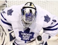 Toronto Maple Leafs goalie James Reimer makes a glove save s they face the Montreal Canadiens during third period NHL hockey action  Thursday, February 24, 2011 in Montreal. The Leafs beat the Canadiens 5-4. THE CANADIAN PRESS/Paul Chiasson