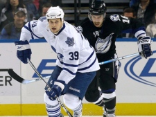 Toronto Maple Leafs center John Mitchell breaks up the ice ahead of Tampa Bay Lightning right wing Teddy Purcell during an NHL hockey game Tuesday, Nov. 9, 2010, in Tampa, Fla. (AP Photo/Chris O'Meara)