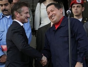 Venezuela's President Hugo Chavez, right, shakes hands with US actor Sean Penn at the Miraflores presidential palace in Caracas, Venezuela, Saturday, March 5, 2011. (AP Photo/Ariana Cubillos) 