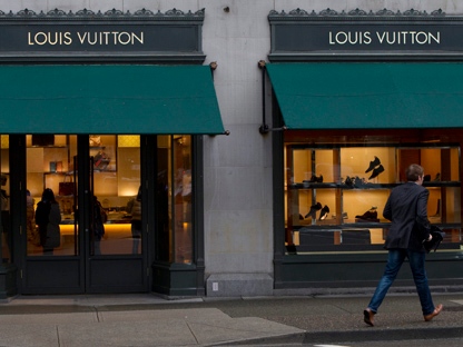 Old building reflected in the Louis Vuitton shopfront, King Street