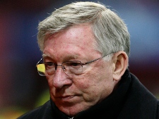 Manchester United manager Alex Ferguson looks on before their Champions League first knockout stage second leg soccer match against Marseille at Old Trafford, Manchester, England, Tuesday March 15, 2011. (AP Photo/Jon Super)
