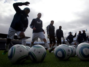 Members of the Vancouver Whitecaps FC are silhouetted as they take part in a practice session in Vancouver on Thursday, March 17, 2011. The Whitecaps will play their inaugural game against Toronto FC on Saturday, March 19, 2011. (THE CANADIAN PRESS/Jonathan Hayward)