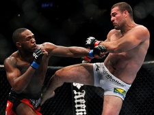 Mauricio Rua, right, kicks Jon Jones during their mixed martial arts match at UFC 128 Saturday, March 19, 2011, in Newark, N.J. Jones won by TKO. (AP Photo/Mel Evans)