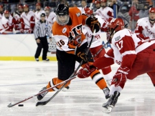 Wisconsin's Ryan McDonagh, right, stick checks RIT's Tyler Brenner in a NCAA Frozen Four semifinal hockey game in Detroit on Thursday, April 8, 2010. Brenner has signed a two-year contract with the Toronto Maple Leafs, the team announced Monday, March 21, 2011. (AP Photo/Paul Sancya)