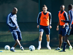 NFL star Chad Ochocinco, left, kicks the ball around with members of the Sporting Kansas City MLS soccer team during a four-day tryout Wednesday, March 23, 2011, in Kansas City, Mo. With the NFL in a lockout, Ochocinco, a wide receiver with the Cincinnati Bengals, has said that it is a good time to check into another sport. (AP Photo/Ed Zurga)