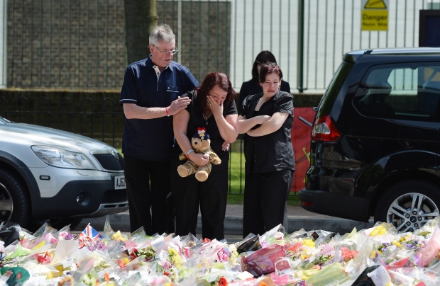 Family of Lee Rigby places tributes attack scene