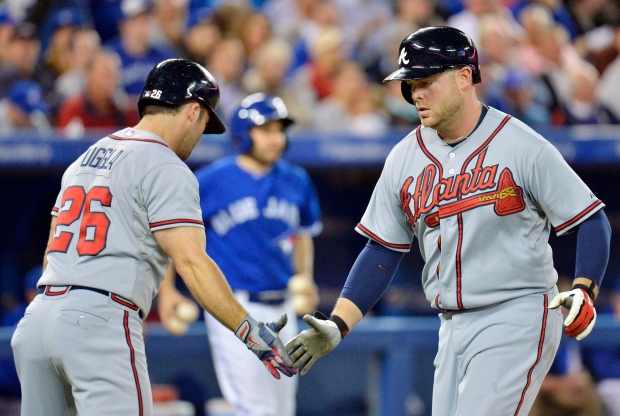 McCann homers twice as Braves outslug Blue Jays 