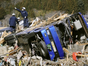 Police officers search for missing persons in the rubble in Otsuchi, Japan, on Tuesday, March 29, 2011. (AP Photo/Kyodo News)