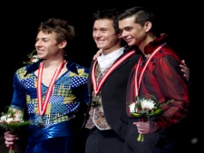 Patrick Chan, of Toronto, centre, celebrates his gold medal win in the Senior Men's Free Program with silver medalist Shawn Sawyer, of Edmundston, N.B., left, and bronze medallist Joey Russell of Labrador City, N.L., at the BMO Skate Canada Nationals in Victoria, B.C. Sunday, Jan 23, 2011. (THE CANADIAN PRESS/Jonathan Hayward)