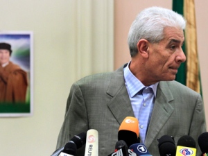 Libya's Foreign Minister Moussa Koussa reads a statement to foreign journalists at a hotel in Tripoli. (AP Photo / Jerome Delay, file)