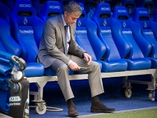 Real Madrid's coach Jose Mourinho from Portugal is seen before a Spanish La Liga soccer match against Sporting de Gijon at the Santiago Bernabeu stadium in Madrid, Saturday, April 2, 2011. (AP Photo/Pedro Acosta)