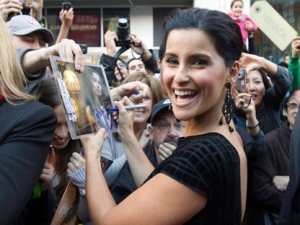 Nelly Furtado signs autographs as she arrives for the Canada's Walk of Fame induction gala in Toronto on Saturday October 16, 2010. Furtado says she's heading into �new terrain� on an upcoming album due out next year. Furtado has launched a Twitter campaign to encourage young people to vote in the upcoming federal election. (THE CANADIAN PRESS/Frank Gunn)