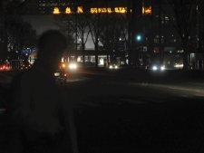 Sendai Station, background, is lit up while parts of street lamps were turned out due to blackout following a big aftershock in Sendai, northern Japan early Friday, April 8, 2011. The quake rocked quake-weary Japan late Thursday, rattling nerves as it knocked out power to the northern part of the country and prompted tsunami warnings that were later canceled. (AP Photo/Yomiuri Shimbun, Keita Iijima) 