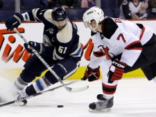 Columbus Blue Jackets' Rick Nash, left, tries to control the puck as New Jersey Devils' Henrik Tallinder, of Sweden, defends during the second period of an NHL hockey game Sunday, March 20, 2011, in Columbus, Ohio. Nash is one of several players confirmed to represent Canada at the IIHF World Hockey Championship. (AP Photo/Jay LaPrete)