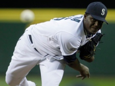 Seattle Mariners starting pitcher Michael Pineda throws against the Toronto Blue Jays in the second inning of a baseball game Tuesday, April 12, 2011, in Seattle. Pineda picked up his first major-league win as the Mariners beat the Blue Jays, 3-2. (AP Photo/Ted S. Warren)