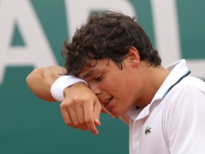 Milos Raonic reacts during his match against David Ferrer at the Monte Carlo Tennis Masters tournament in Monaco on Thursday, April 14, 2011. (AP Photo/Claude Paris)