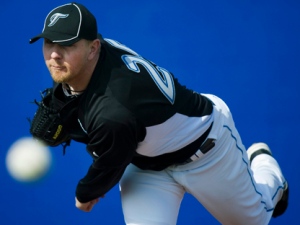 Former Toronto Blue Jays pitcher David Purcey throws a pitch during baseball spring training in Dunedin, Fla., on Thursday, Feb. 24, 2011. (AP Photo/The Canadian Press, Nathan Denette)