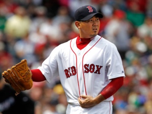 Boston Red Sox starting pitcher Daisuke Matsuzaka of Japan walks to the dugout during Boston's 9-1 win over the Toronto Blue Jays in a major league baseball game at Fenway Park in Boston Monday, April 18, 2011. (AP Photo/Winslow Townson)