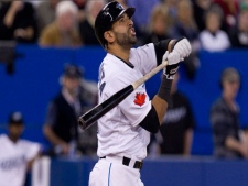 Toronto Blue Jays Jose Bautista reacts to a foul ball during third inning MLB baseball action against New York Yankees pitcher A.J. Burnett in Toronto on Tuesday, April 19, 2011. (THE CANADIAN PRESS/Chris Young)