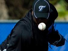 Toronto Blue Jays pitcher Frank Francisco keeps a close eye on the ball during baseball spring training in Dunedin, FL, on Tuesday, Feb. 15, 2011. (THE CANADIAN PRESS/Nathan Denette)