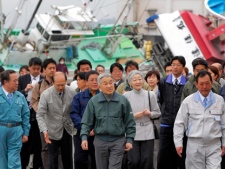 Japan's Emperor Akihito, center left, and Empress Michiko, center right, tour the Otsu fishing port heavily damaged by the March 11 earthquake and tsunami on Friday, April 23, 2011.(AP Photo/Itsuo Inouye)